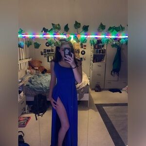Pretty blue dress! One shoulder tie and slit. Worn once for homecoming.